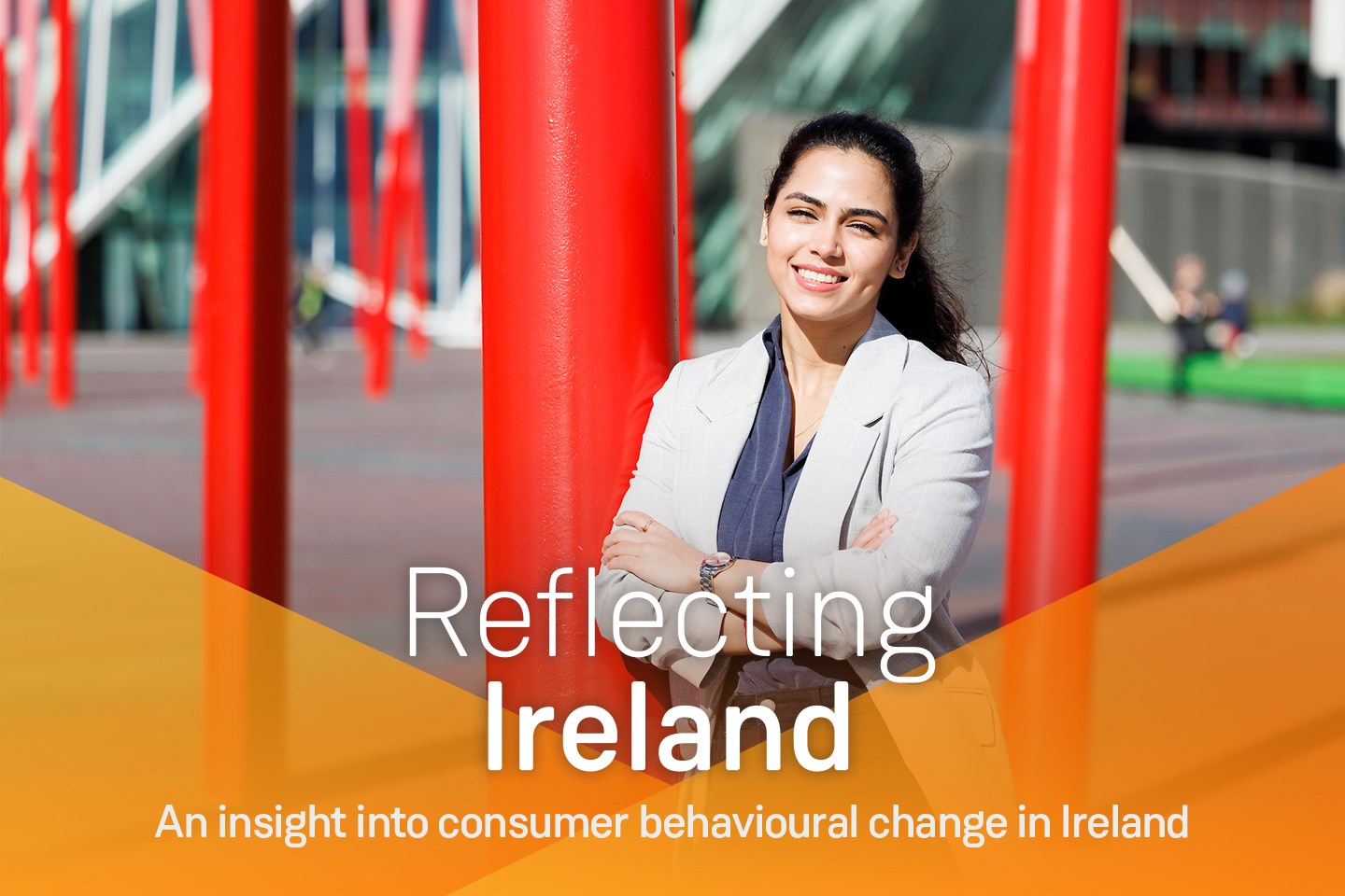 Young woman smiling and standing in front of art installation, text on image ' Reflecting Ireland, An insight into consumer behavioural change in Ireland